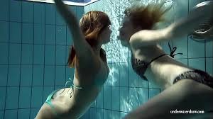 Zuzanna and lucie are stripping and playing pranks in the pool. Redhead Simonna Showing Her Body Underwater