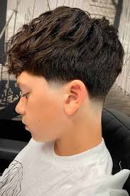 My son agreed to cut his hair finally. He currently has thick, shoulder  length hair and wants to do something like this.. who should I take him to?