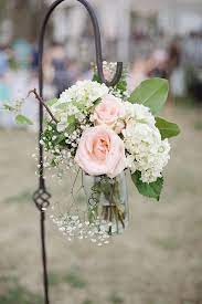 You can also use them in addition to a reserved tag like this to highlight a reserved aisle at your ceremony. Hanging Mason Jars Wedding Aisle Decoration Ideas Emmalovesweddings