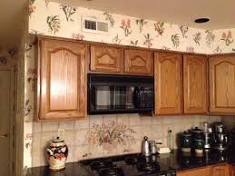 Soffits for upper cabinets at walls consist of a level underside and a vertical face. Unsightly Kitchen Soffits Over Cabinets