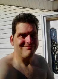 I couldn't get a picture of what his face looks like but he was looking  inside parked cars outside of superstore, I told him that I was going to  notify security he