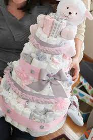 This castle diaper cake is perfect for a princess baby shower and makes a great centerpiece. Prettiest Baby Girl Diaper Cake Ever Baby Girl Diaper Cake Diaper Cakes Girl Baby Shower Diaper Cake