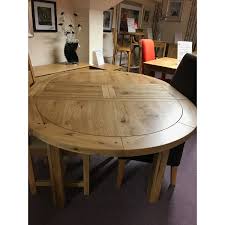 Here is an expanding circular dining table that can accommodate up to 8 people when fully expanded. Fresno Small Round Extending Dining Table Furniture And Mirror