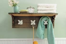 Install salvaged wall candle sconces to hold them and give your bathroom instant ambiance. Bathroom Towel Holder Ideas