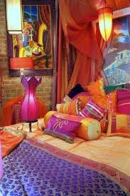 A darkly painted wall can make a bold impression when accompanied by a burst of color. Moroccan Colorful Bedroom Decorating In Purple Orange And Raspberry Indian Room Decor Room Decor Bedroom Indian Room