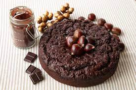 Puréed roasted chestnuts and a touch of buttery rum go into flavoring the delicate sponge cake layers and some of the rich chocolate frosting. Chocolate Chestnut Cake Thinly Spread
