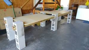 Easy Cinder Block Tables Perfect For Garage Sales Using 12 Cinder Blocks And Four 4x4x6 Boards And Some Smaller P Block Table Cinder Block Cinder Block Bench