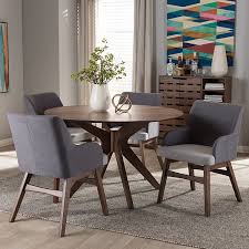 Enhance your kitchen with swanky midcentury modern table and chairs. Baxton Studio Monte Mid Century Round Dining Table Arm Chair Set