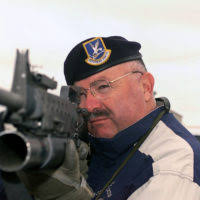 US Air Force (USAF) STAFF Sergeant (SSGT) Mike Hayes (left) help USAF  SENIOR AIRMAN (SRA) Jeffery Sack, with wind adjustment