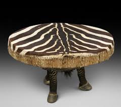 This beautifully made zebra print coffee table is an attractive addition for any room. 1960s French Art Deco Black Leather Round Coffee Table Vinterior
