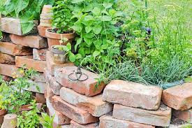 Metal outside decor to put on a brick wall. 15 Creative Ways To Use Bricks In Garden Design Gardener S Path