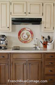 Kitchen cabinets wood uppers painted lowers. 31 Days Of French Inspired Style Day 24 Kitchens French Blue Cottage