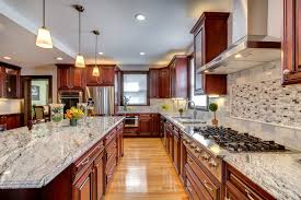 Rounded kitchen highlights light treated wooden cabinets with recessed lighting over dark tile floor. Viscont White Granite Countertops With Cherry Cabinets Contemporary Kitchen Boston By Stone Projects Houzz