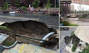 chinese road engulfed by giant sinkhole