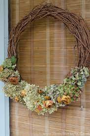 Lay out the hydrangea flower clumps loosely on the wreath base. How To Make A Dried Hydrangea Wreath