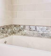 Glass tile, mosaics, and decorative accents are a great addition to any home. Ivory Subway Tile Paired With Mirrored Arabesque Tile All That S Missing Is A Few Mirror Tiles Bathroom Glass Tile Backsplash Kitchen Arabesque Tile Bathroom