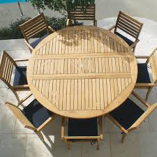 Avant 9 Piece Teak Patio Dining Set W 72 Inch Round Drop Leaf Table And Sunbrella Canvas Navy Cushions By Royal Teak Collection Bbqguys Round Patio Table Patio Dining Set Teak Patio Furniture
