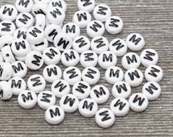 A hundred people whose names begin with the same letter were . Letter M Beads Etsy