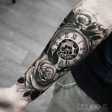 The sleeve on his left arm has special meaning. Guy With Cross Biceps Tattoo Carrying Music System Photo 1 All Tattoos For Men
