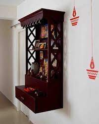 Most small apartments have to accommodate pooja area either in the living room or dining area and here the former idea has been adopted. Best 5 Pooja Room Designs For Indian Homes Honestcollars Temple Design For Home Room Door Design Pooja Room Design