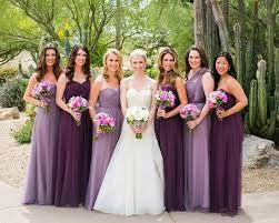 Brides Bridesmaids Photos Bride And Bridesmaids In Dresses In Shades Of Purple Purple Bridesmaid Dresses Purple Bridesmaids Brides And Bridesmaids