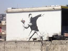 There are many strong meanings behind this piece and that is what makes the image so provocative. The Botanist Historian Love Is In The Air Flower Thrower Banksy