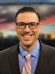 Some may think it's glamorous to anchor. Behind the scenes, I'm wearing a  fleece, a leg strap for my microphone, and Nikes. Bonus points if you find  the living legend behind me. #