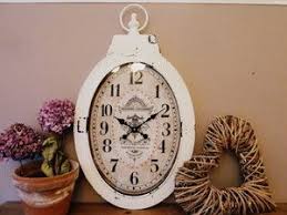 A grouping of clock faces and pocket watches hung on a white wall. Pin On Kitchen