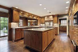 I have walnut cabinets in a simple slab style with two different countertops, neither white. What Color Wood Floor With Dark Cabinets Home Decor Bliss