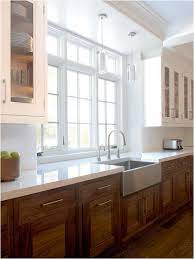 Not all roads lead to a crisp kitchen design, but painted cabinetry is one that does. Wood Kitchen Cabinets Revisited Centsational Style Kitchen Design Kitchen Remodel Farmhouse Kitchen Cabinets