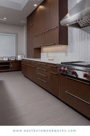 Flat Panel Cabinetry With Bar Pulls On Stained Kitchen Cabinetry Kitchen Cabinets Kitchen Kitchen Cabinetry