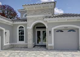 Lighten up the look with a crisp white trim. Gray Stucco House Ideas And Inspiration