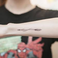 For more unique design ideas, consider combining the infinity symbol with a rose, bible verse, arrow, or feather. Infinity Arrow Tattoo Tattoo Gallery Collection
