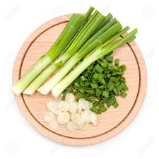I discard the rubber band and any wilted outer leaves cut into thirds: Freshly Cut Green Onion On Wooden Cutting Board Stock Photo Picture And Royalty Free Image Image 42178336