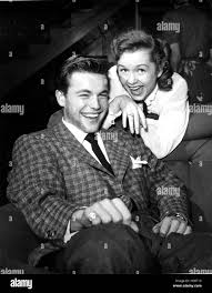 Debbie Reynolds, showing off her engagement ring from Eddie Fisher to  former beau Robert Wagner, 1955 Stock Photo