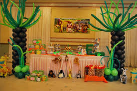 Your baby's first birthday party will be the best one ever as this is your chance to introduce him to friends and family and have a great time. Jungle Madagascar Theme Tree Balloon Columns For A Boy S First Birthday Party Birthday Party Balloon Balloon Decorations Party Party Balloons