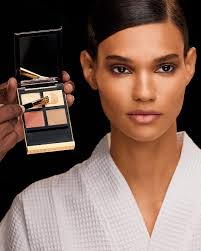 Get the look: Sweep the rich mocha hue of Eye Color Quad in 01 Golden Mink  allover lids, then apply the shimmering gold of Eye Color Quad in 26  Leopard Sun at