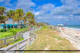 Things to do in vero beach, florida: Boardwalk Along Beach Blue Sky Jaycee Park Vero Beach Florida Royal Stock Photo