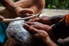 Indonesian Tattooists Revive Tribal Traditions Artdaily Traditional Tattoo Method Tattoo Artists Indonesian Tattoo