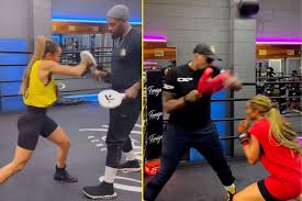 Kate Abdo shows fast hands with Malik Scott who trained Deontay Wilder  against Tyson Fury