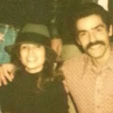 This is my mom and dad can you clean this pic up, I'm sure it's from early  60's