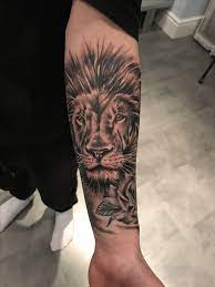 Watercolor lion face tattoo designs on thigh for boys and girls. Tattoo Tips Lion Lion Forearm Tattoos Cool Tattoos Lion Tattoo