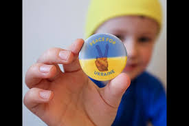 VIDEO: Cochrane boy breaks cash box in support of peace for Ukraine