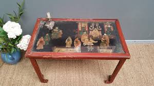 With over 16 lots asian style black lacquer and gilt decorated coffee table, brass capped feet, height 14 inches, top. Antique Asian Coffee Table With Panel Of Lacquer
