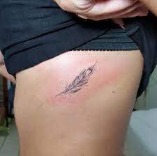 Tiny Feather Tattoo Cage Tattoos Rib Tattoos For Women Ribcage Tattoo