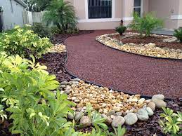Planting flowers along the side of your house, edging. Go Grassless Florida Florida Grassless Yards Small Backyard Landscaping Front Yard Landscaping Design No Grass Backyard
