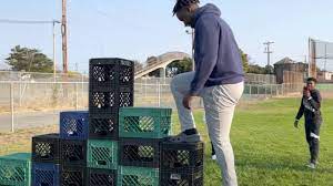 The goal of the challenge is to climb up one side of stacked milk crates and walk down the other side without falling to the ground. Oshdy0fogg Mlm
