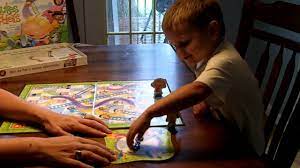 The game is over when the child lands exactly on square 100. Playing Chutes And Ladders Youtube