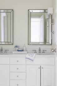 A small modern bathroom outfitted with white subway tile and gray penny tile could look pretty plain, but an interesting country sink and round galvanized mirror add an unexpected touch. 10 Small Bathroom Design Ideas Home Design Jennifer Maune