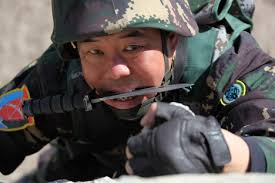 PLA commando in Xinjiang MD, Sky Wolf regiment. Note blade in mouth. Dude,  turn it the other way.